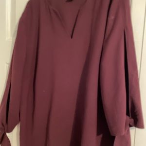 Chicos size 3 top with split arms.  Burgundy in color